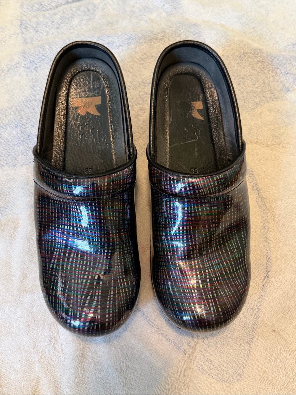 Dansko Black Iridescent Plaid Slip-On Clogs